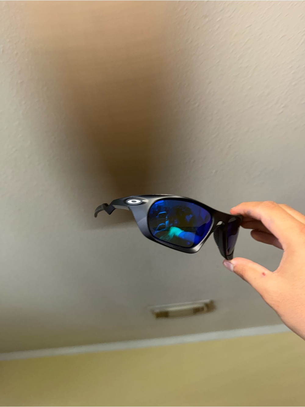 Oakley Women's Black Frame Sunglasses with Blue Mirrored Lenses
